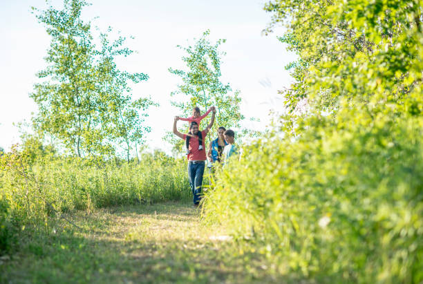 Young Hispanic family hiking and camping together in nature.