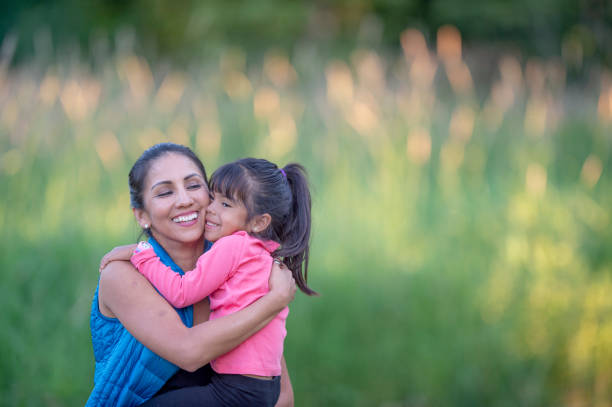 istock Hispanic mother and daughter enjoying nature 1223893973