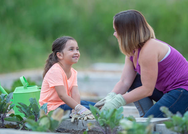 istock Mother and daughter gardening 1223894116