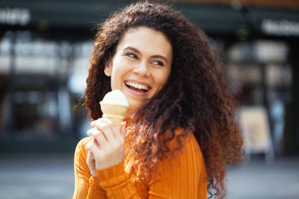 istock Beautiful woman eating ice-cream 1223894980