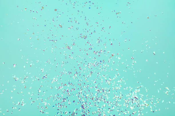 istock Holographic flying sparkles on blue festive background. 1223895932
