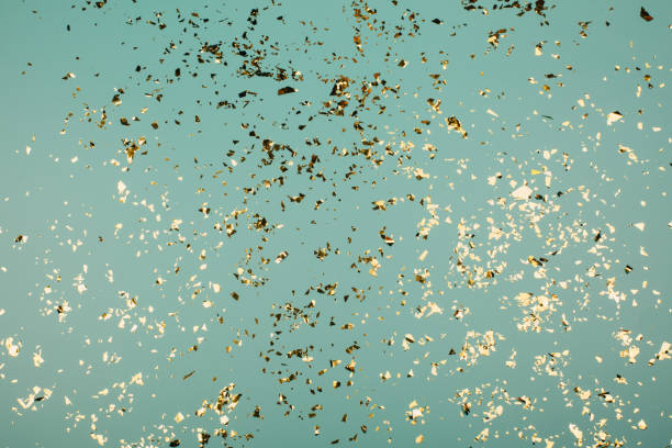 istock Golden flying sparkles on blue holiday background. 1223895934