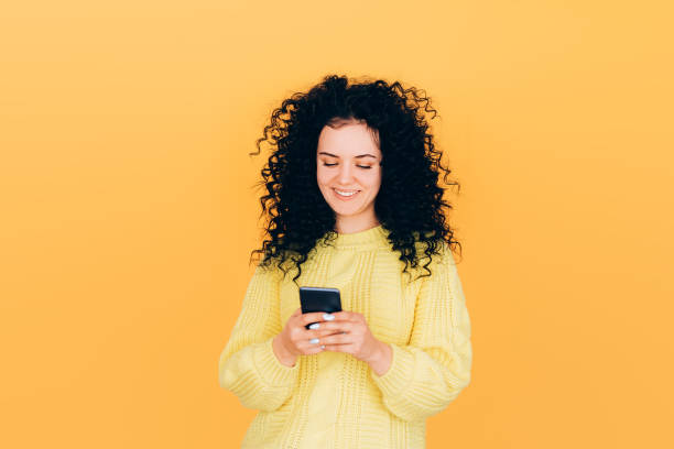 istock girl with phone 1223895950