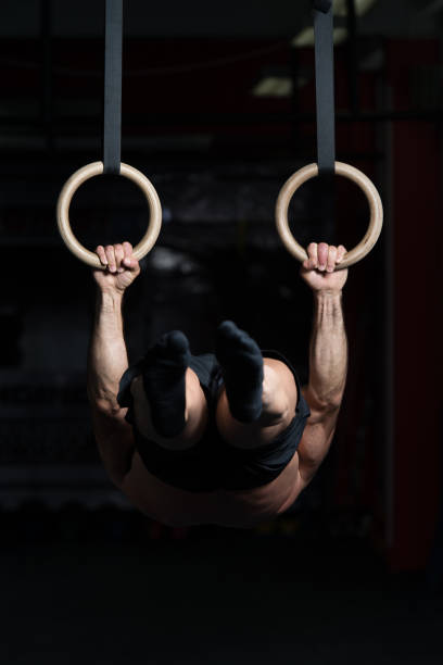 istock Muscular Man Holding Two Rings 1223897030