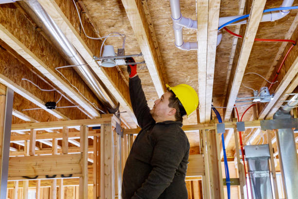 istock Electrician technician of a spotlight in the ceiling 1223897274