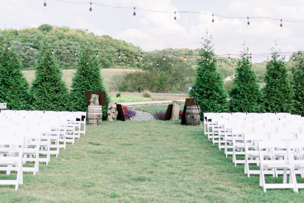 istock Outdoor Wedding Ceremony Set-Up with White Chairs Set Up 1223898740