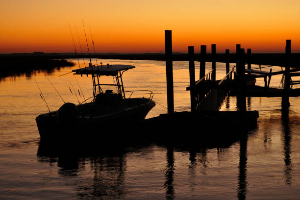 istock Fishing Boat Silhouetted at Dawn 1223902312