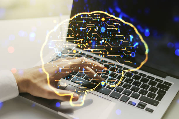 istock Double exposure of creative artificial Intelligence symbol with hands typing on laptop on background. Neural networks and machine learning concept 1223903257
