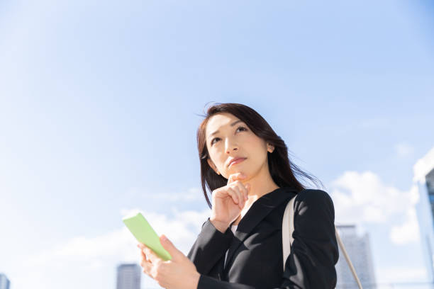 istock asian woman who see a smart phone,think, 1223903853
