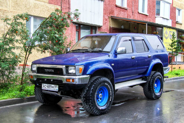 Toyota Hilux Surf Novyy Urengoy, Russia - August 7, 2012: Blue offroad car Toyota Hilux Surf in the city street. toyota hilux stock pictures, royalty-free photos & images