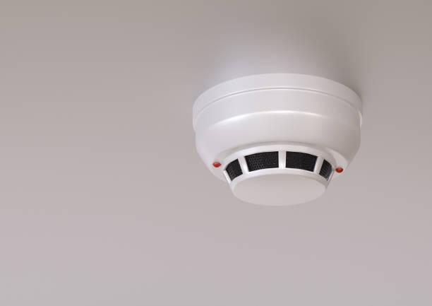 smoke detector isolated on the ceiling of modern house with smart system. 3D rendering