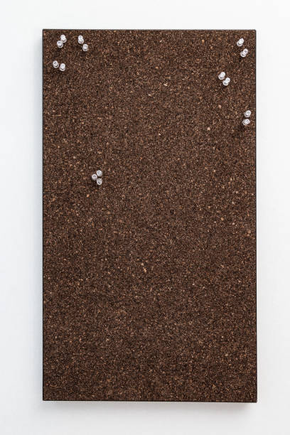 bulletin board from dark brown cork material with transperent pins for stickers. textured wooden cork closeup as background. - 7678 imagens e fotografias de stock