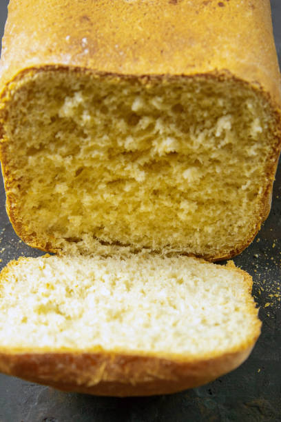 istock Fresh fragrant bread against a dark background. Assortment of baked bread on dark table background. Fresh fragrant bread on the table. Front views, close-up 1223908795