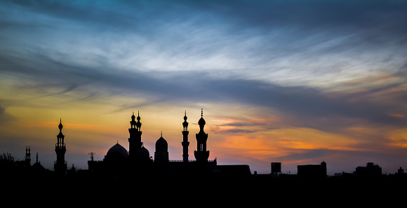 Sunset in Cairo from Al Azhar Park, In the background the two minaret of mosques Al-Rifa'i and Sultan Hassan in Cairo Egypt