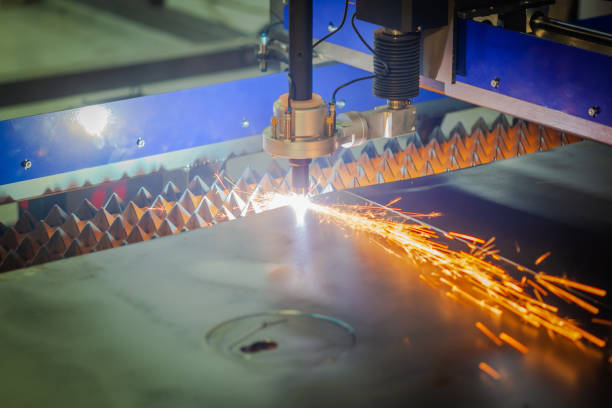 istock cnc plasma cutting machine cuts metal sheet. Sparks fly 1223915946
