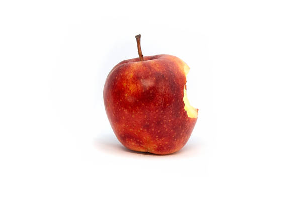 istock red Apple bitten off eaten on a white background, core 1223916222