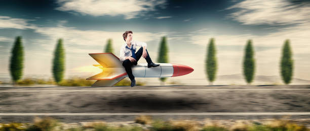 istock Businessman on a rocket missle flying on highway . 1223917083