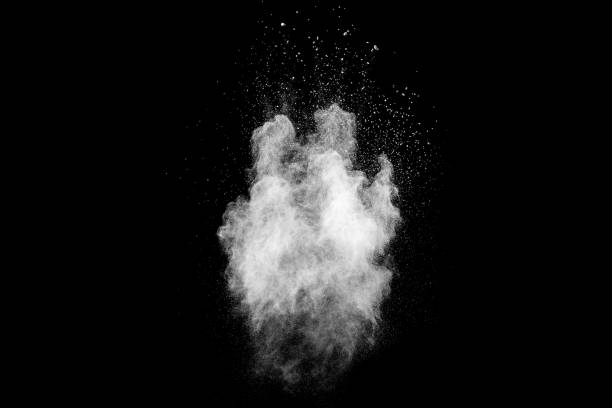 istock Bizarre forms of white powder explosion cloud against black background.White dust particles splash. 1223920247
