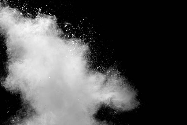 istock Bizarre forms of white powder explosion cloud against black background.White dust particles splash. 1223920258