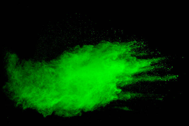 istock Green powder explosion on black background.Green dust particles splash. 1223920260