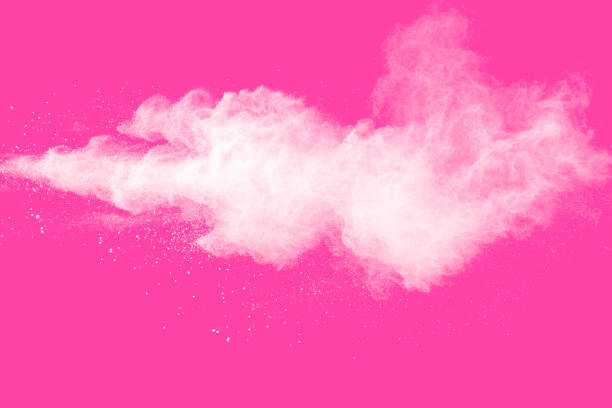 istock Freeze motion of white particles on pink background. Abstract white dust explosion. 1223920274