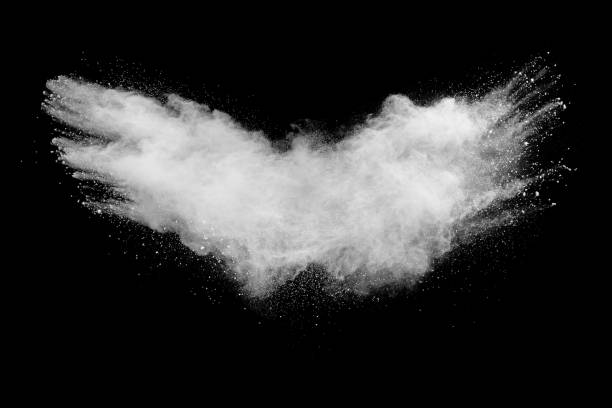 istock Bizarre forms of white powder explosion cloud against black background.White dust particles splash. 1223920409