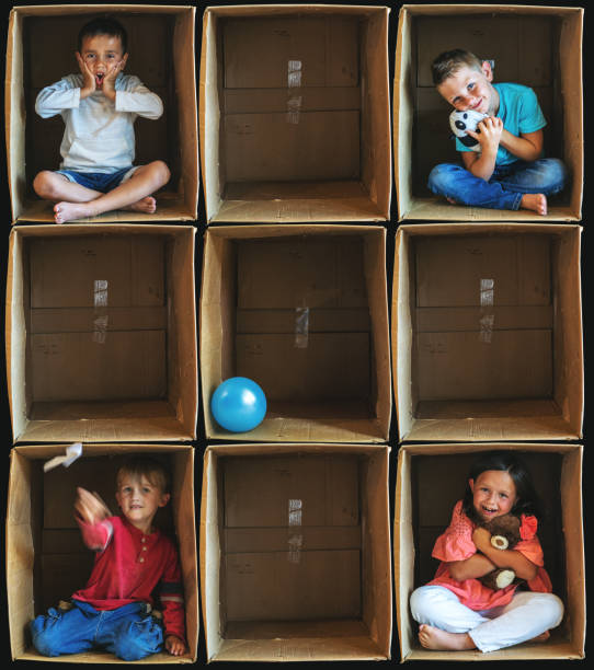 istock Coping with Solitude Small Children Inside Enclosure Series Involving Cardboard Box Related to Shelter In Place During Illness Crisis 1223921169