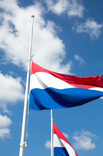 Flag of the Kingdom of the Netherlands in red, white and blue.