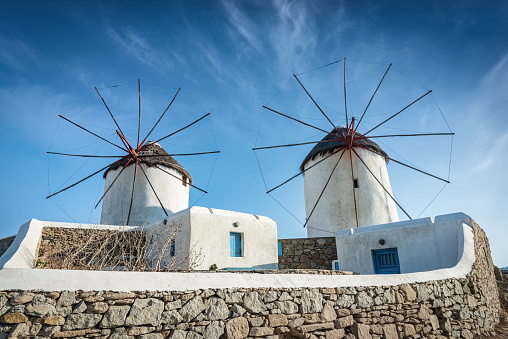 Famous Mykonos Greek Traditional Windmills, built by the Venetians in the 16th century, on top of coastal harbor hill. Chora, Alefkandra, Mykonos, Cyclades Islands, Greece, Southern Europe, Europe