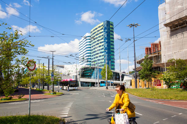 Modern Arnhem Central railway station Arnhem, The Netherlands, May 2020: View of modern Arnhem Central railway station and electric trolley buses arriving and taking off. trolley bus stock pictures, royalty-free photos & images