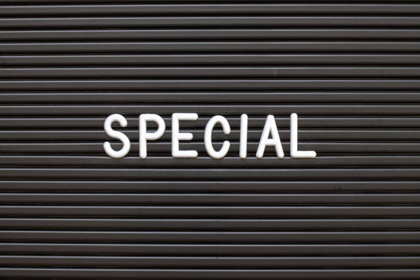istock Black color felt letter board with white alphabet in word special background 1223925759