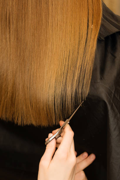 istock Scissors cut girls hair 1223929811