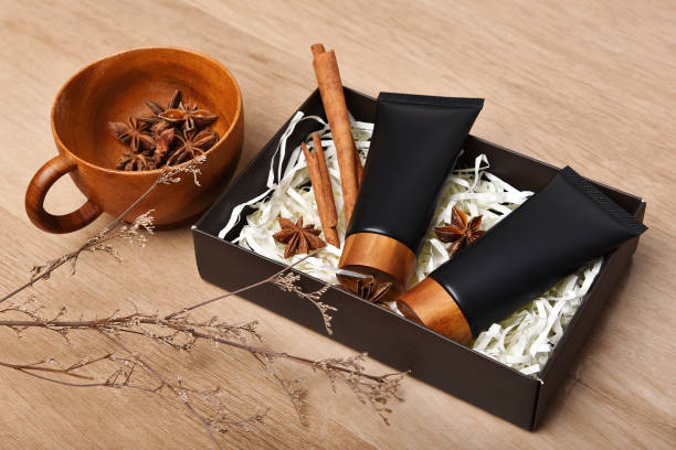 istock Cosmetic black bottle containers packaging with cinnamon and anise aromatherapy oil essence extract, Blank label for organic herb branding mock-up, Natural skincare beauty product concept. 1223932428