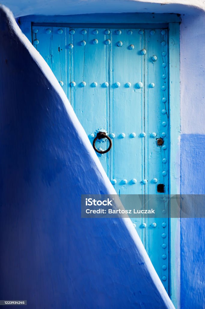 Blue door in Chefchouen city, Morocco Chefchaouen Stock Photo