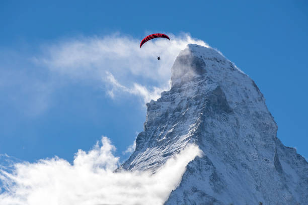 istock Paraglider flies in front of the Matterhorn 1223934281