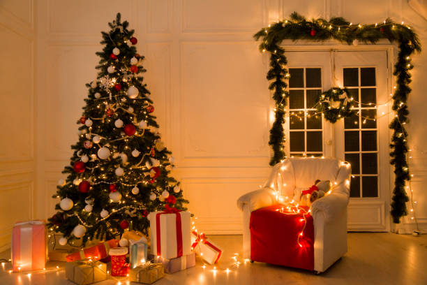 istock Christmas tree with presents and decorations the lights new year Garland 1223935196