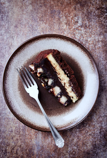 istock Piece of Chocolate Cake on a Plate. Rustic stone background. Top view 1223936328