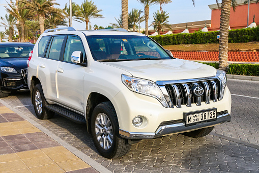 Dubai, UAE - November 16, 2018: Grey offroad vehicle Toyota Land Cruiser Prado 150 in the city street.