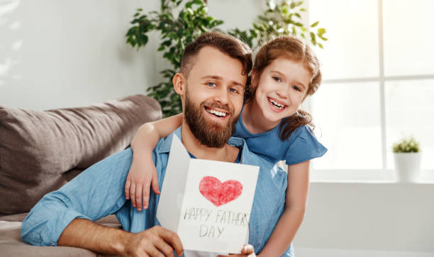 istock Little girl congratulating dad with Fathers day 1223936458