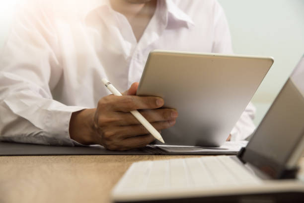 istock businessman working with business documents on office table with digital tablet computer and graph finance diagram 1223940030