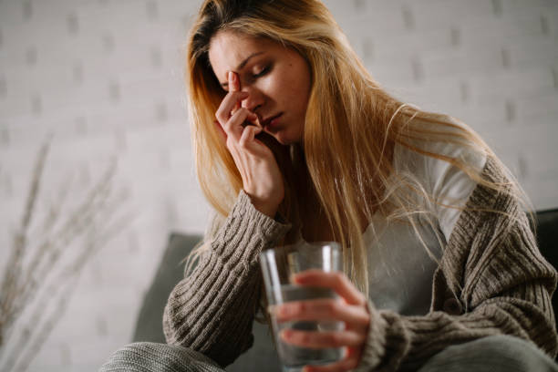 istock Woman having headache at home. 1223940151