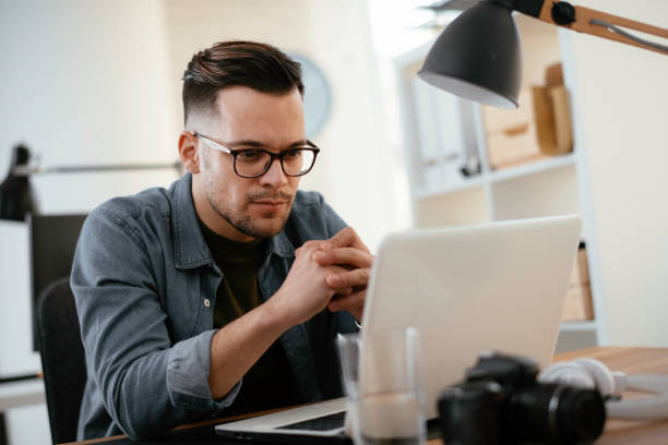 istock Young businessman working in office. 1223941520