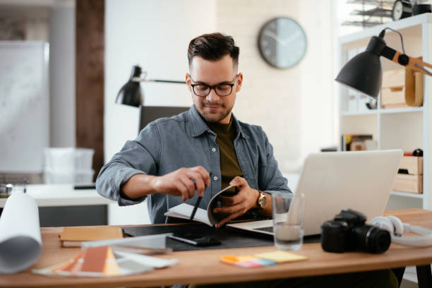 istock Young businessman working in office. 1223941539