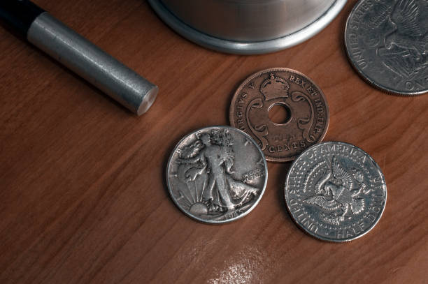 istock Set of old coins to perform coin magic including a walking libery and an eagle half dollar and a east Africa ten cents coin 1223945826