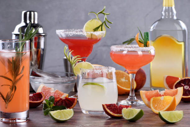 drinks and cocktails with Tequila-based different citrus fruits stock photo