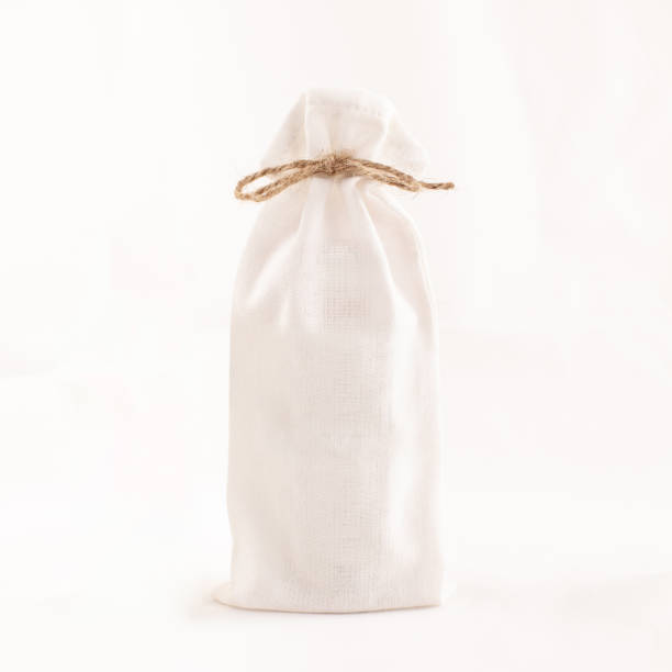 istock White cloth bag tied with rope on a white background. 1223949799
