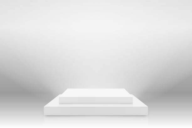 istock White 3d podium mockup in square shape. Empty stage or pedestal mockup illuminated with spotlight. Podium or platform for award ceremony and product presentation 1223949928