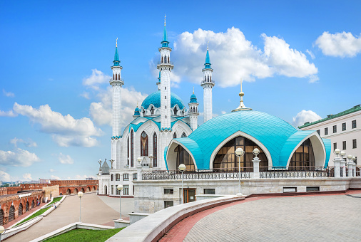 Kul-Sharif Mosque and the building under the dome in the Kazan Kremlin under beautiful white clouds and blue sky
