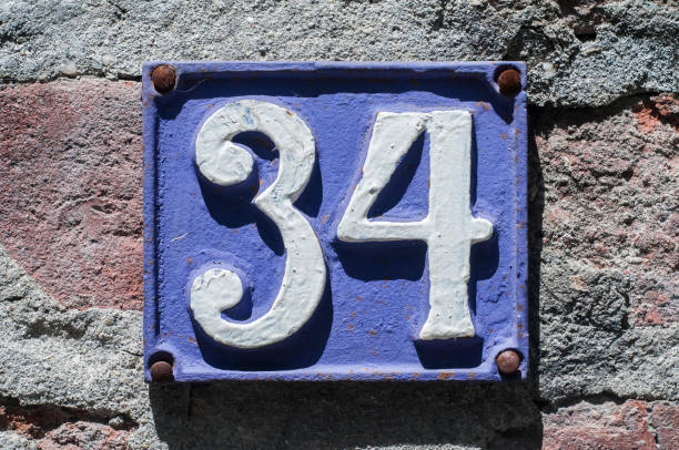 istock Old retro cast iron plate number 34 1223950081