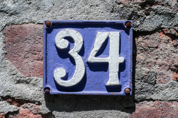 istock Old retro cast iron plate number 34 1223950095